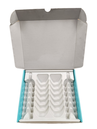 Corrugated box with thermoform insert cavities